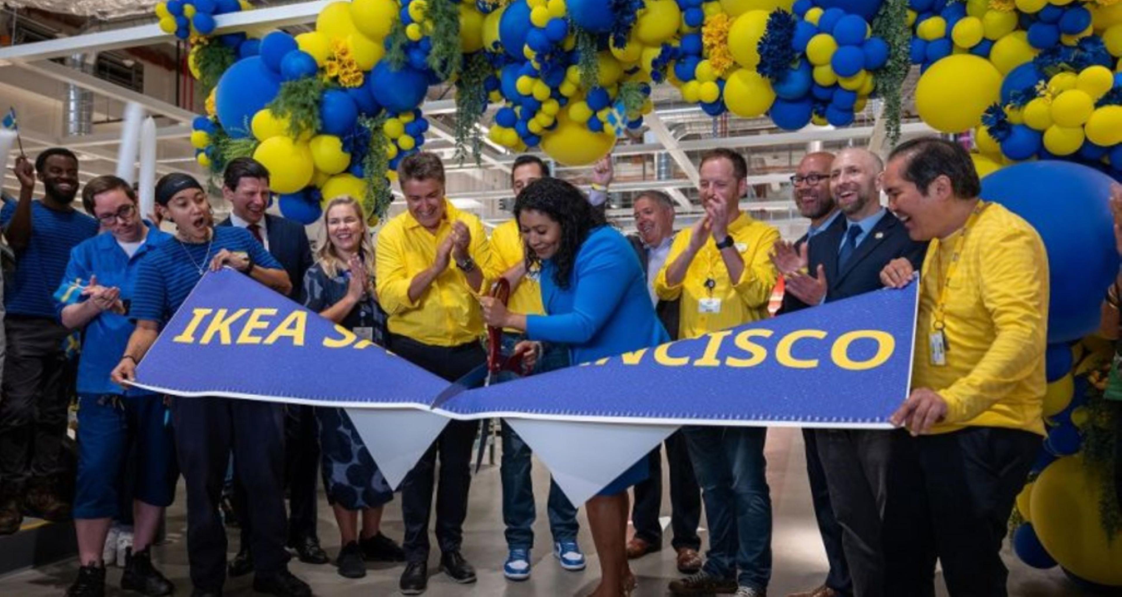 Javier Quiñones, CEO and chief sustainability officer at IKEA U.S., cutting a banner.