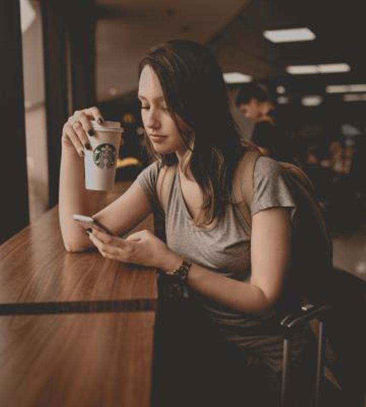 Woman drinking Starbucks