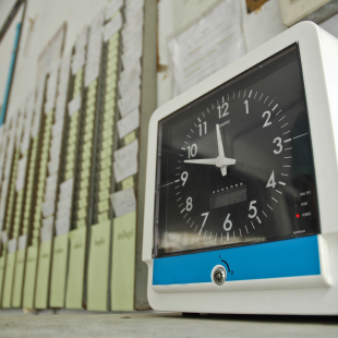 workers punch cards and time clock