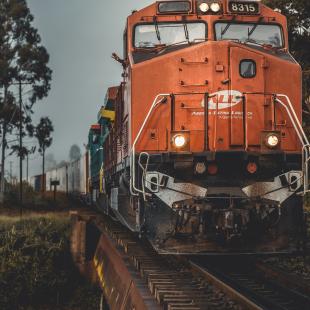 image shows a train on the tracks bringing deliveries