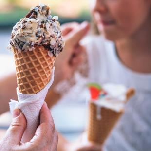 Person holding ice cream cone