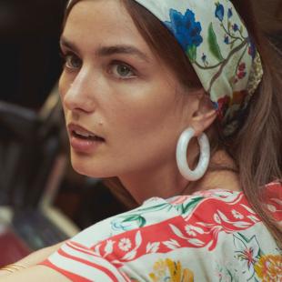 Anthropologie model wearing bandana and colorful shirt