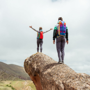 Two hikers wearing Cotopaxi gear