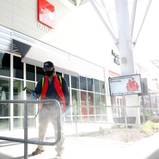 Worker cleans handrails at Nebraska Crossings