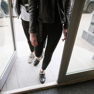 Two customers entering a store