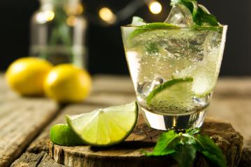 Margarita drink in a clear glass with slice of lime